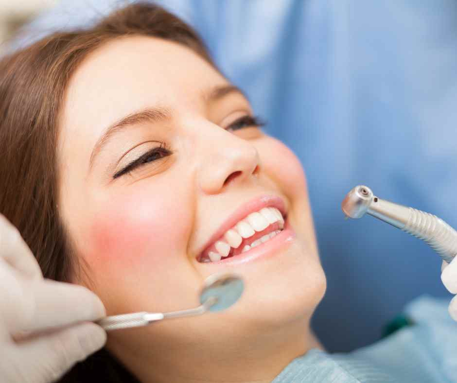 Dentist examining a patient's teeth in a clinic